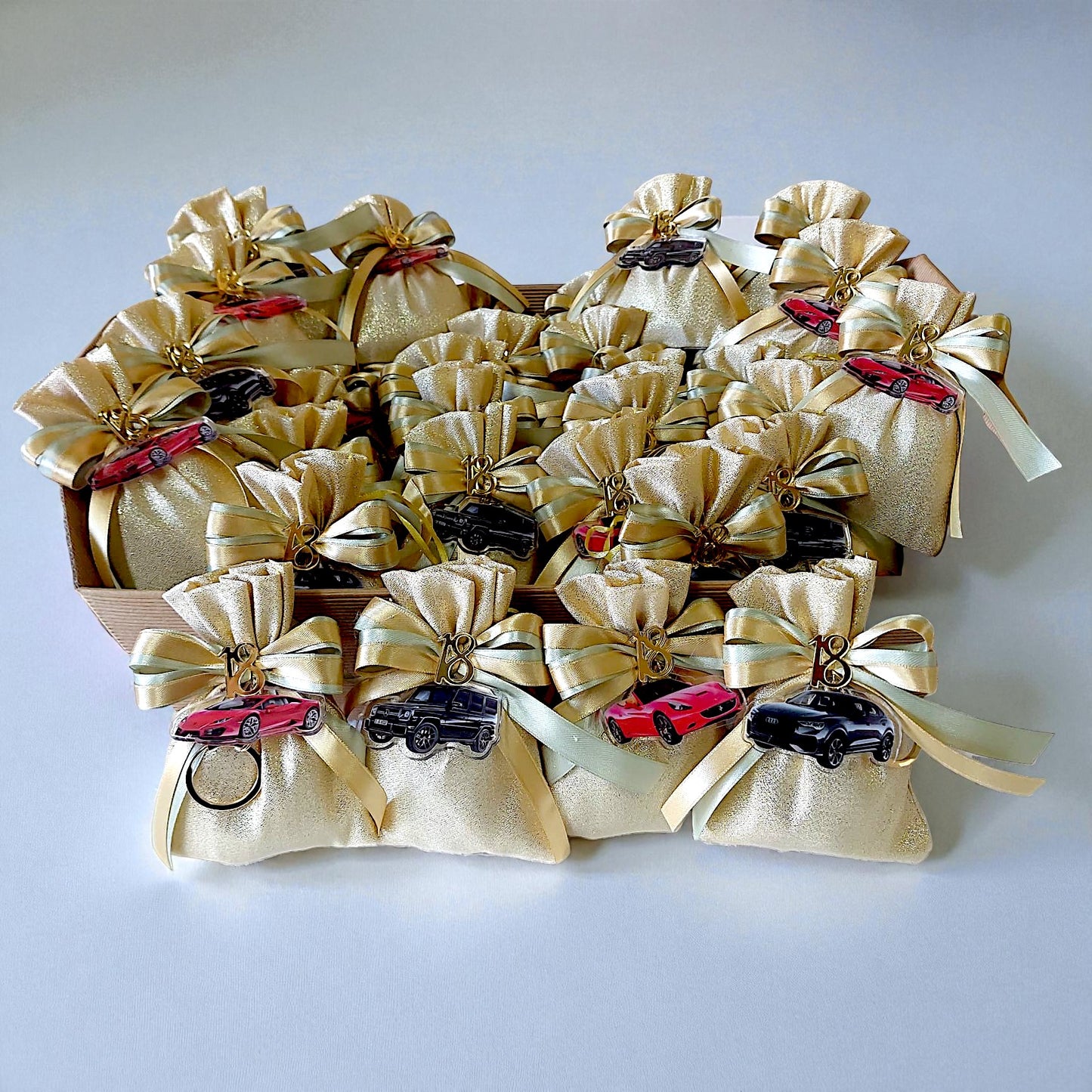 Plexiglass keychains with a chic handbag and sports car theme