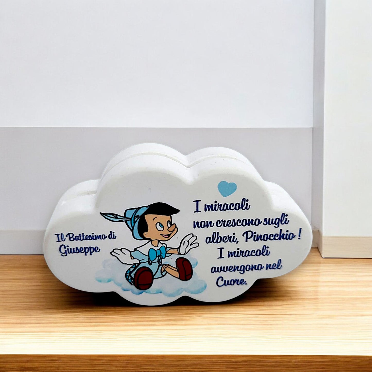 Portafoto in gesso resinato a forma di cuore o nuvola in tema Pinocchio