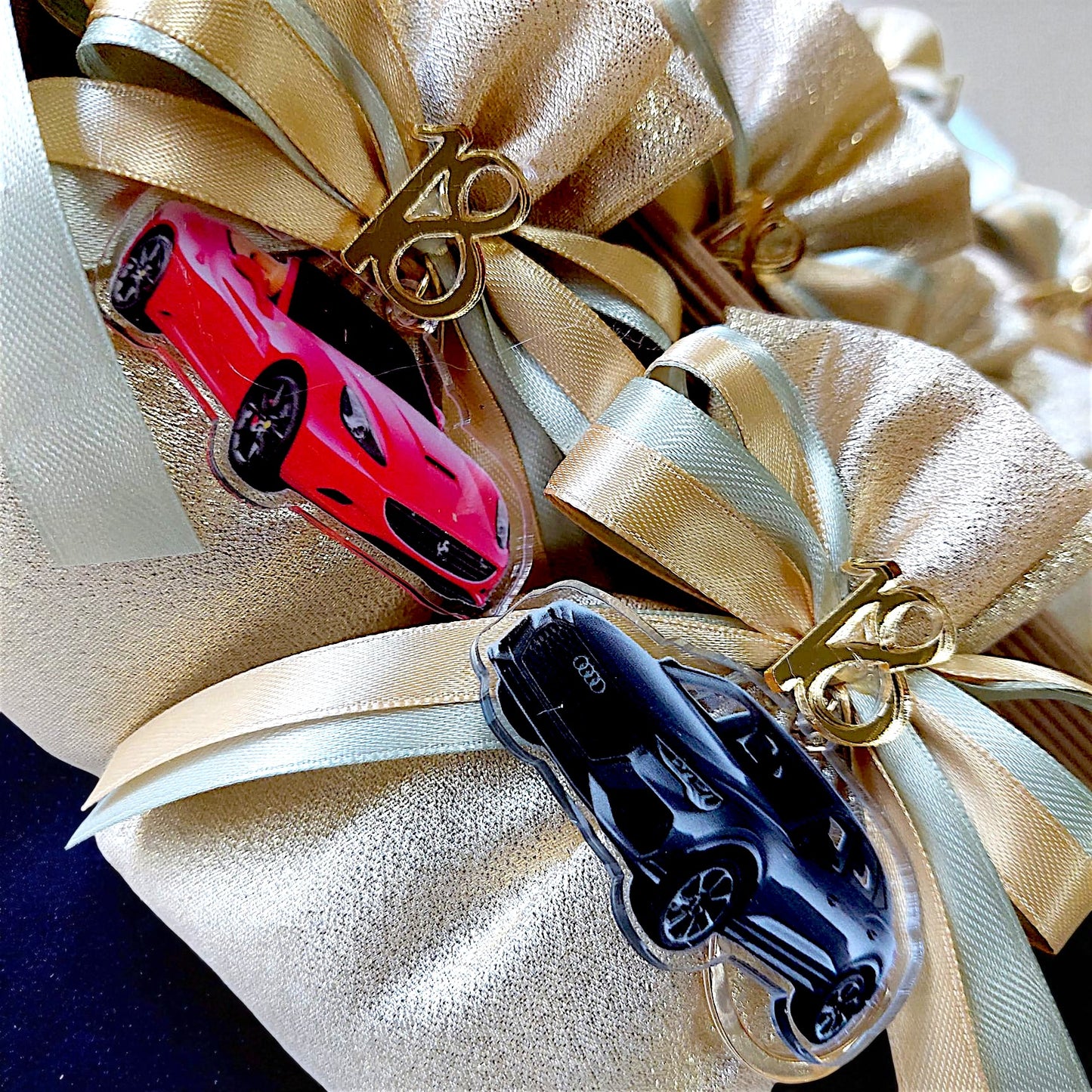Plexiglass keychains with a chic handbag and sports car theme